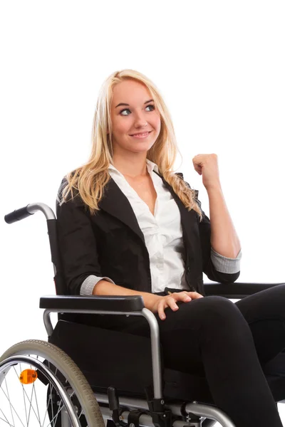 Blond girl sitting in a wheel chair — Stock Photo, Image