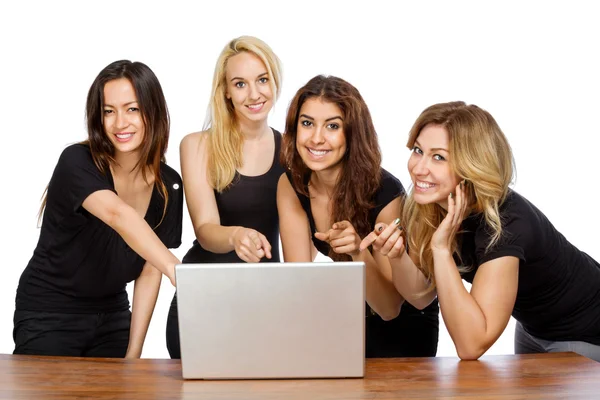 Group of girls pointing at a laptop — Stock Photo, Image