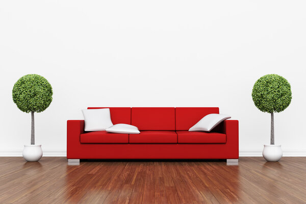 Red couch on wooden floor