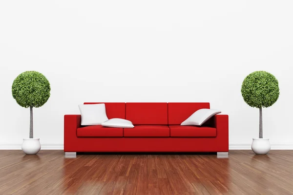 Red couch on wooden floor — Stock Photo, Image