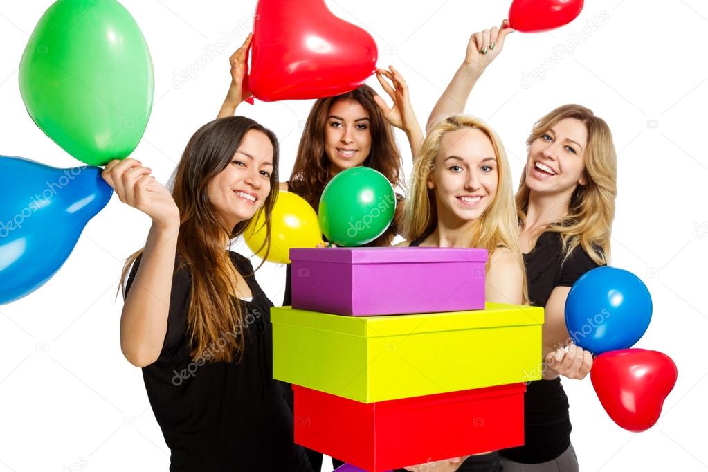 Girls having a party with baloons and boxes