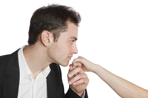 Unga professionella kysser kvinnlig hand Stockbild