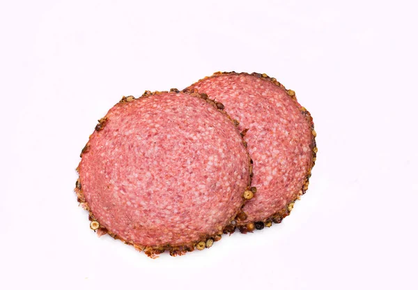 Two Salami Slices Black Pepper Isolated Meat Cold Cuts Slices — Stock Fotó