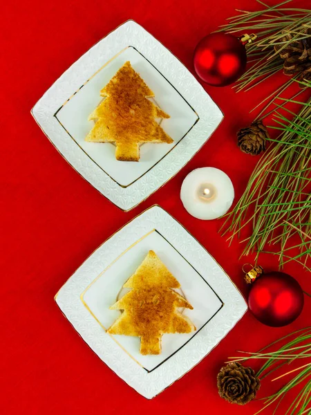 Christmas Table Setting Toast White Plate Silverware Candle Red Tablecloth — Stock Photo, Image