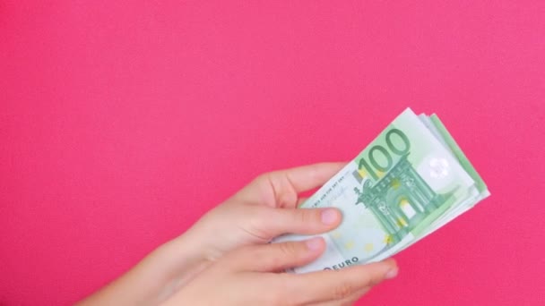 Hand Holds Euro Money Bills Pink Color Background Counting Cash — Stock Video