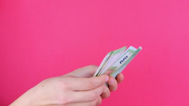 Hand Holds Euro Money Bills Pink Color Background Counting Cash — Stock Video