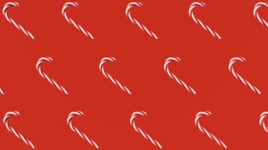 Christmas candy canes 3D looped animation red background. Sweet traditional Christmastide lollipop caramel rotating pattern festive Xmas Saint Nicholas Day peppermint stick Winter seasonal ornament 4K