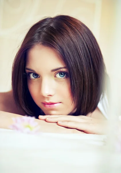 Beautiful young woman on the bed — Stock Photo, Image