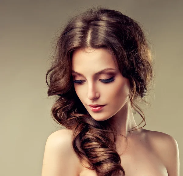 Beautiful brunette woman with curly hair — Stock Photo, Image