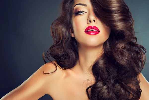 Sensual brunette woman with curly hair — Stock Photo, Image