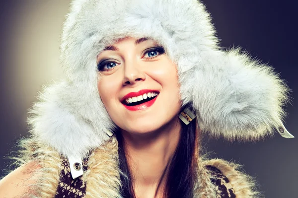 Happy woman in fur white hat — Stock Photo, Image