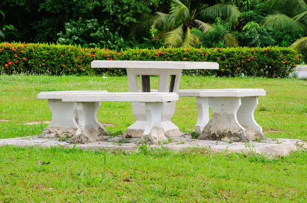 Marble table in park with the tree — Stock Photo, Image
