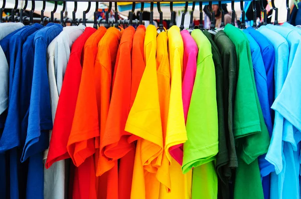 Colorful t-shirt with hangers — Stock Photo, Image