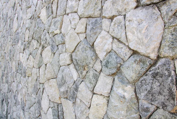Monochrome shot of stone wall texture background — Stock Photo, Image