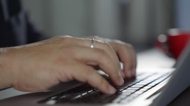 Professional user worker using typing on laptop notebook keyboard sit at home office desk. Work from home. Using a computer to work via the Internet during the COVID-19 outbreak. B roll slow motion 4k