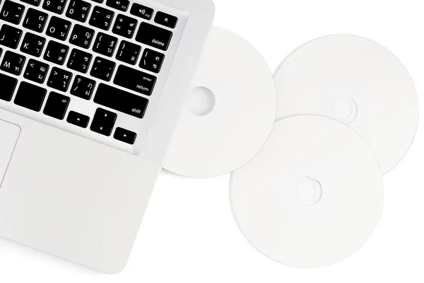 Laptop und Compact Disc — Stockfoto