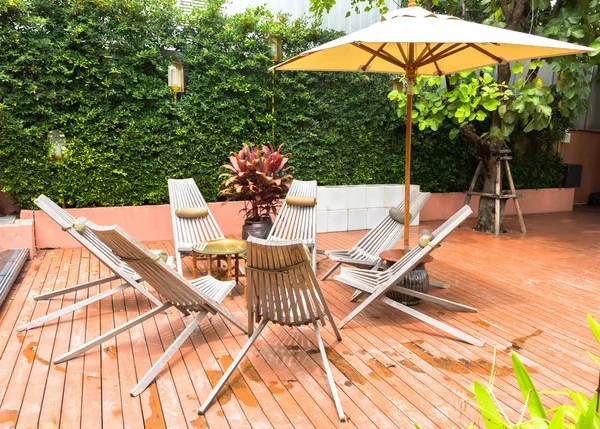 Outdoor chairs and tables on wooden terrace — Stock Photo, Image