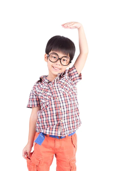 Asian boy growing tall and measuring himself — Stock Photo, Image