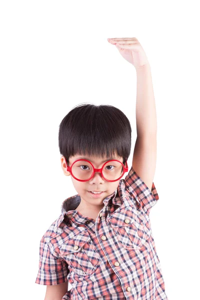 Asian boy growing tall and measuring himself — Stock Photo, Image