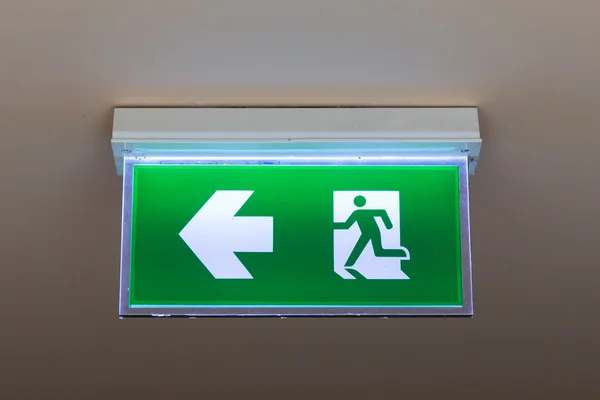 Green emergency exit sign — Stock Photo, Image