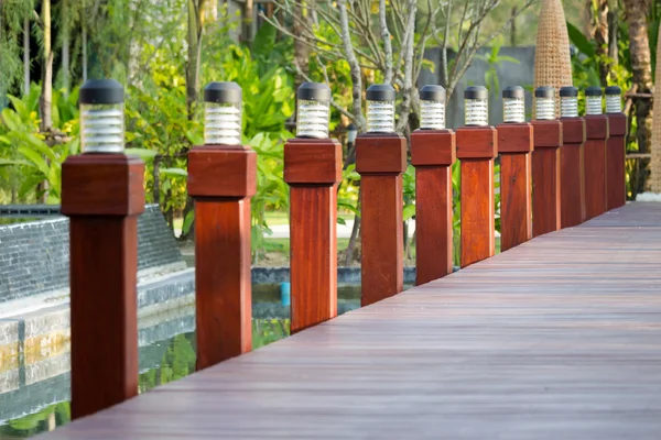 Light pole on wooden bridge — Stock Photo, Image