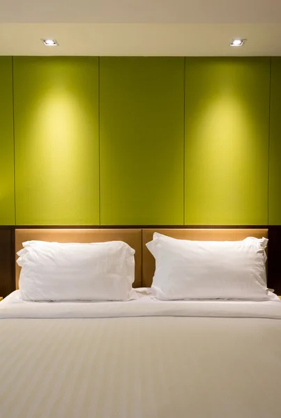 An empty wall over a bed — Stock Photo, Image