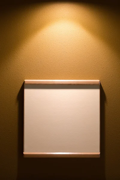 Frame for text or photo on the wall with light — Stock Photo, Image