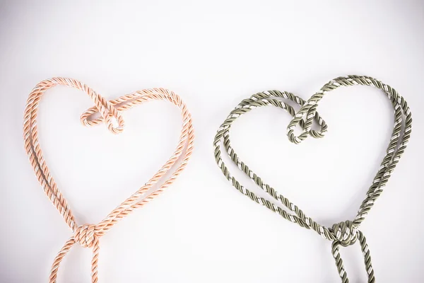Orange and green rope in heart shape with vignette — Stock Photo, Image