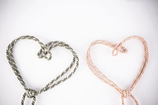 Orange and green rope in heart shape with vignette — Stock Photo, Image