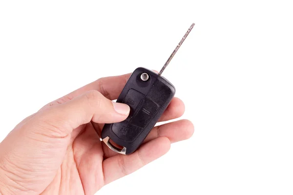 Uomo mano su sfondo isolato in possesso di una chiave di auto — Foto Stock