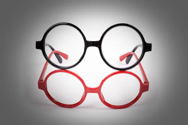 Red and black glasses with lighting effect — Stock Photo, Image