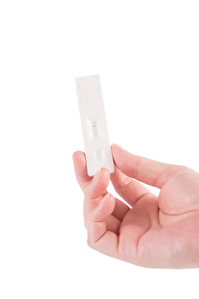 Zwangerschapstest in hand geïsoleerd op wit — Stockfoto