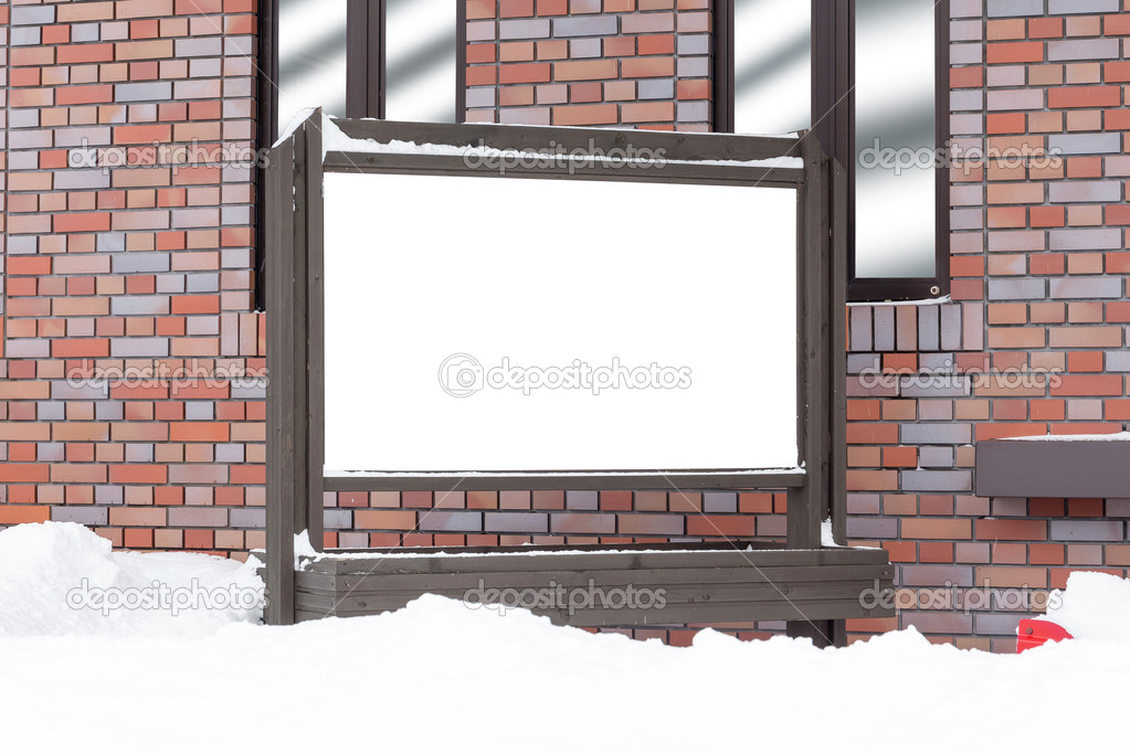 blank billboards attached to a buildings exterior brick wall