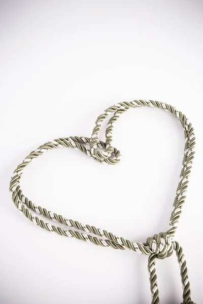 Rope valentine heart of simple design on white with copy space — Stock Photo, Image