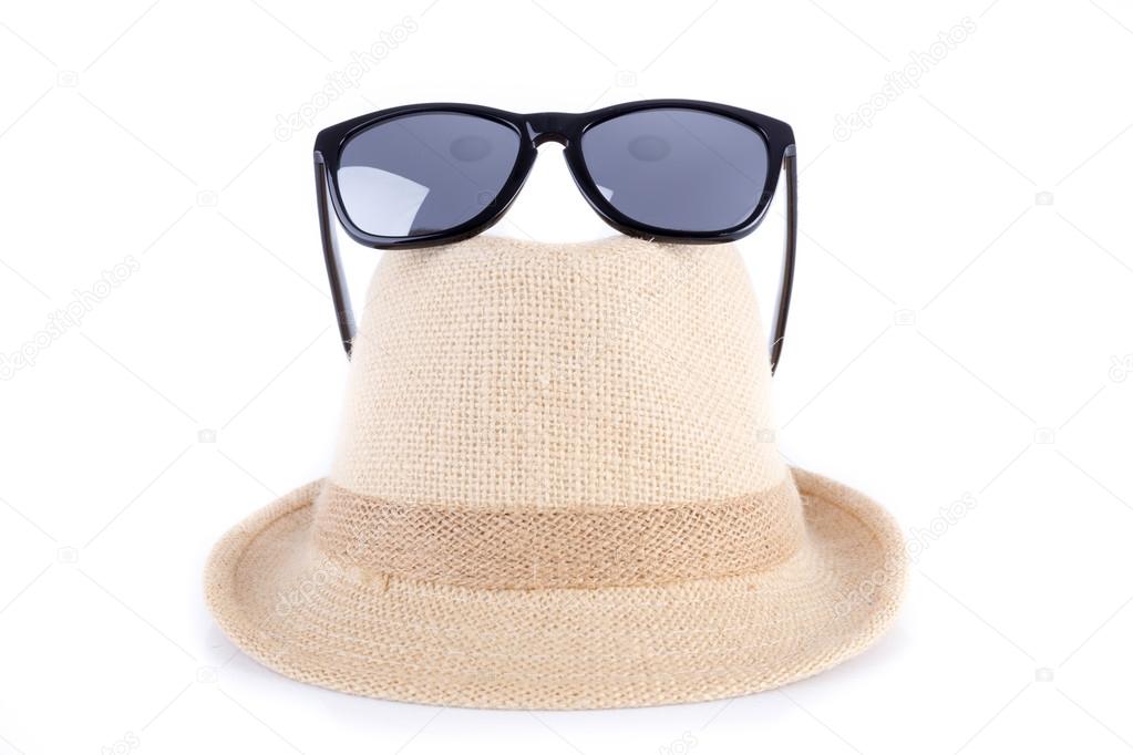 hat and sunglasses isolated on a white background