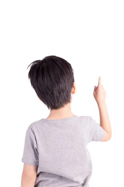 Vista trasera de un niño de escuela sobre fondo blanco apuntando hacia arriba — Foto de Stock