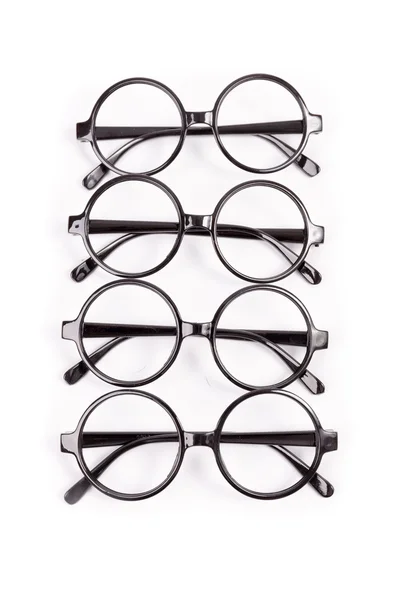 Pila de gafas negras aisladas en blanco — Foto de Stock