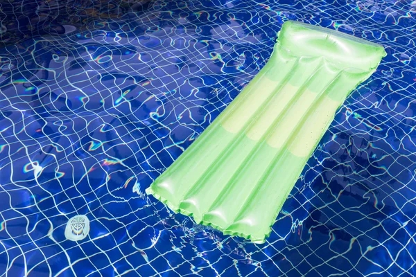 Inflatable raft floating in swimming pool — Stock Photo, Image