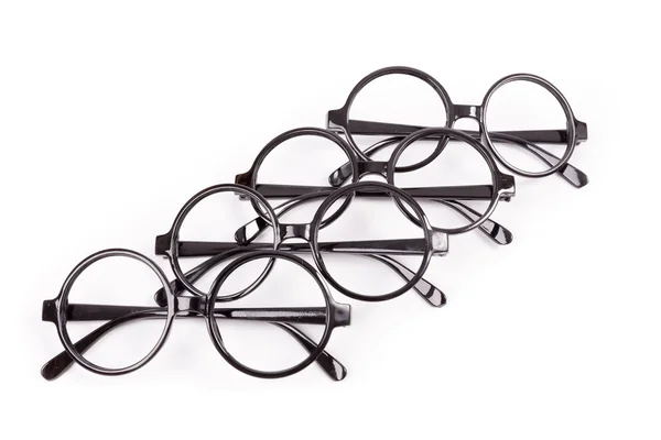 Stack of black glasses isolated on white — Stock Photo, Image