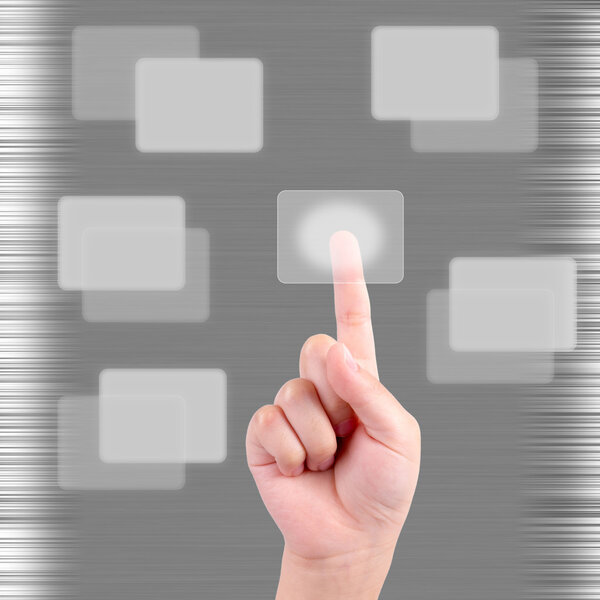 Child hand pressing a touchscreen button