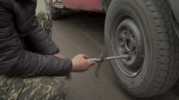 Unscrewing Nuts Replace Car Wheel — Video