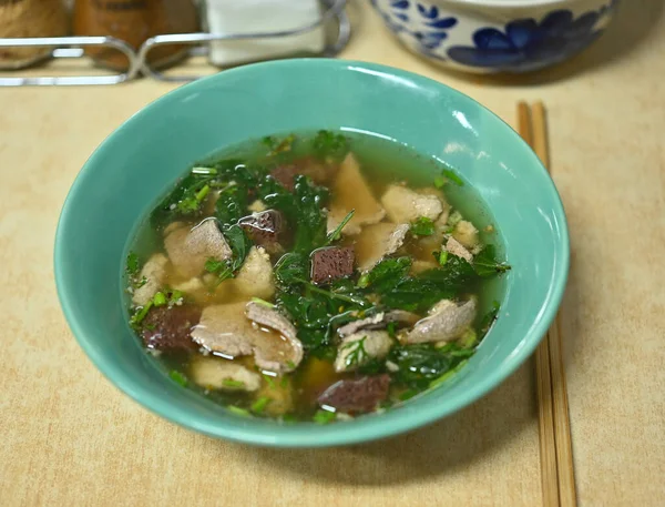 Thai and chinese Style Clear Soup with mugwort  ,Congealed pork ,Congealed pork , pork entrails clear soup .Thai ,chinese culture in life style.