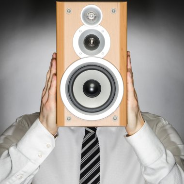 Man with speaker in front of face clipart