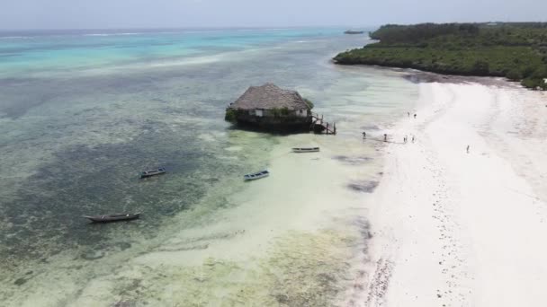 Aerial view of a house on stilts in the ocean on the coast of Zanzibar, Tanzania, slow motion — Stock Video