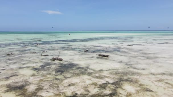 Aerial view of low tide in the ocean near the coast of Zanzibar, Tanzania, slow motion — Stock Video