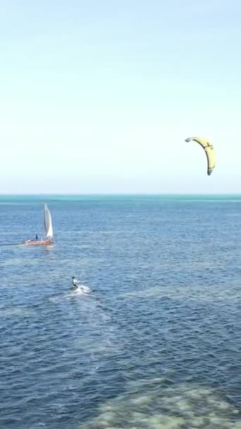 Vertical video kitesurfing near the shore of Zanzibar, Tanzania — Stock video