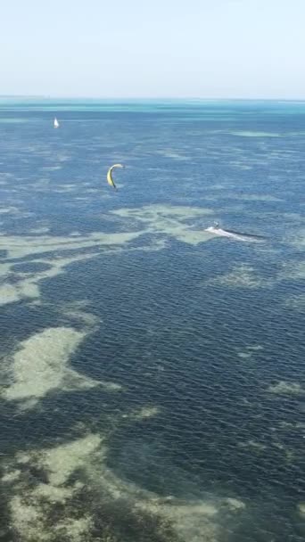 Vertical video kitesurfing near the shore of Zanzibar, Tanzania — Stock video