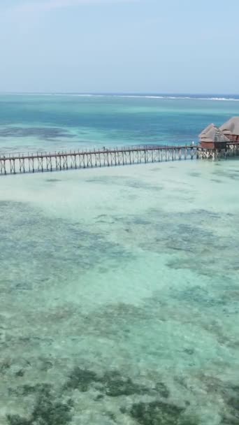 Vertical video house on stilts in the ocean on the coast of Zanzibar, Tanzania — Stock video