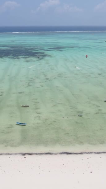 Vertical video kitesurfing near the shore of Zanzibar, Tanzania — Stock Video