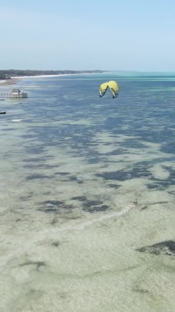 Vertical video kitesurfing near the shore of Zanzibar, Tanzania — Stock video